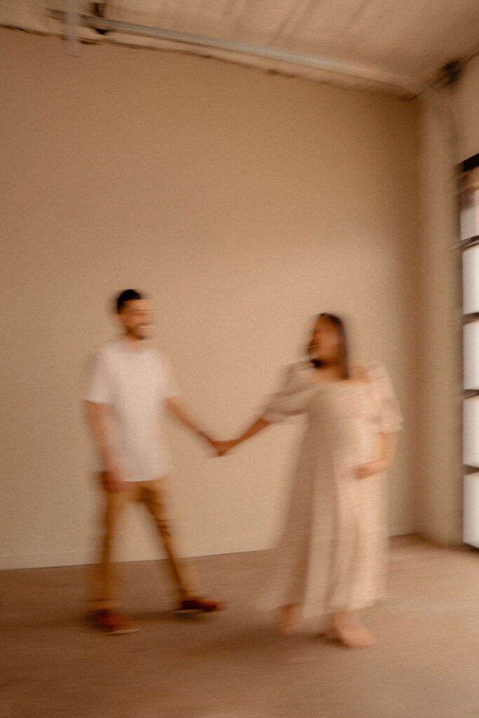Blurry photo of couple holding hands